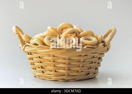 russian bread rings in wicker basket, on white Stock Photo