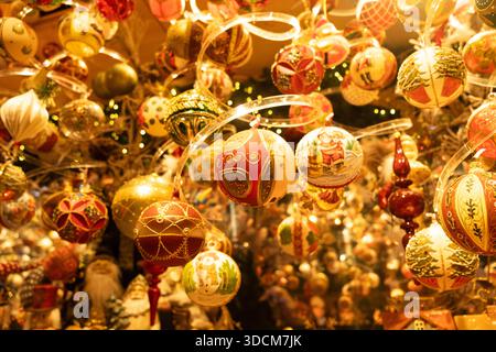 Christmas glass balls hanging on spiral transparent stands. Stock Photo