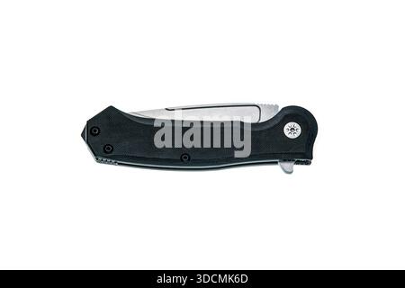 Black folding pocket knife with a textured handle isolated on a white background. Stock Photo