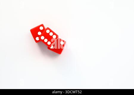 Three red dices on a white background. Top angle photo. Stock Photo