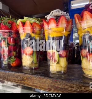 Assorted Fresh Berries and Exotic Fruits in Plastic Cups Stock Photo