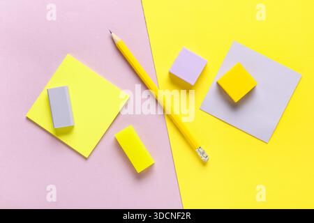 Different rubber erasers with sticky notes and pencil on color background Stock Photo