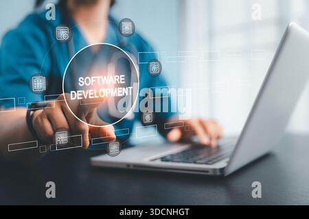 Developer touching software development interface working on laptop, representing  application creation coding Stock Photo