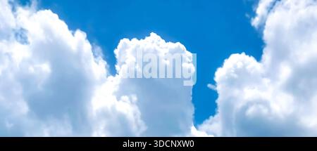Wide Panoramic View of Fluffy White Cumulus Clouds in Blue Sky Stock Photo