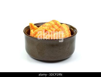 Bacon Chips. Delicious bacon snacks isolated on white background. Pelleted salted snack bacon. Smoked bacon flavored chips. Stock Photo