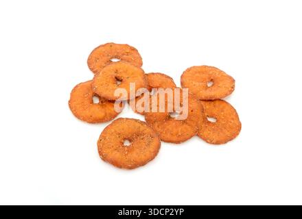 Salted round pretzels isolated on white. Cracker chips with sea salt isolated on white background. Round shape appetizers. Salty crackers isolated Stock Photo