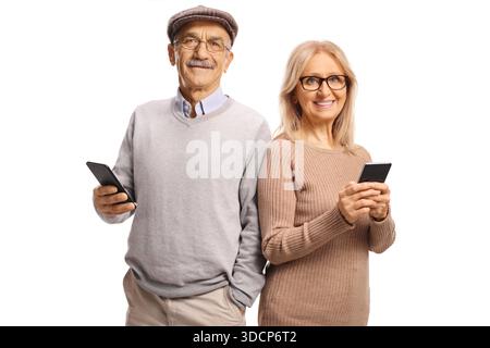 Happy senior couple using smartphones isolated on white background Stock Photo
