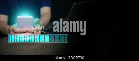 A man with a smartphone and a laptop starts the process with a digital progress bar loading, Workflow execution, step tracking, system loading, projec Stock Photo
