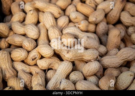Close-up view of raw peanuts in shells showing natural texture and earthy tones Stock Photo