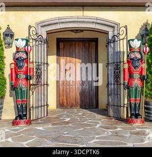 pair of life size toy soldiers standing on either side of the front door at wolffer estate vineyard Stock Photo