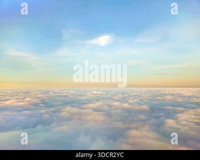 Cloudscape from above and colorful sky on an early morning Stock Photo