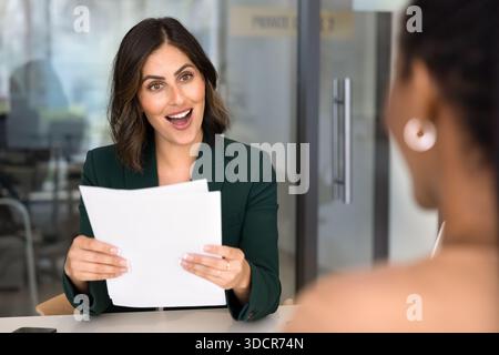 Excited positive HR manager woman meeting with job applicant Stock Photo