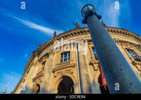 Creative low angle view of the Bode Museum on Museum Island in Berlin, photographed during golden hour. Bode-Museum, close up, blue sky, editorial. Stock Photo
