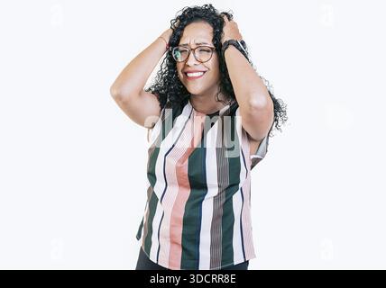 Overwhelmed young woman holding her forehead. Stressed and tired afro woman holding her head isolated Stock Photo