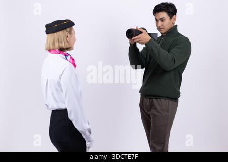 Photographer taking picture of a woman in uniform Stock Photo
