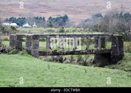 old concrete bridge over the stream outside the white o morn ruins of the quiet man cottage teernakill north county galway republic of ireland Stock Photo