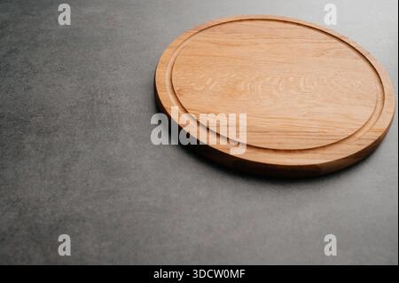 Meat or bread cutting board for homemade baking on table. Food recipe concept at stone background texture with copy space. Flat lay top view. Stock Photo