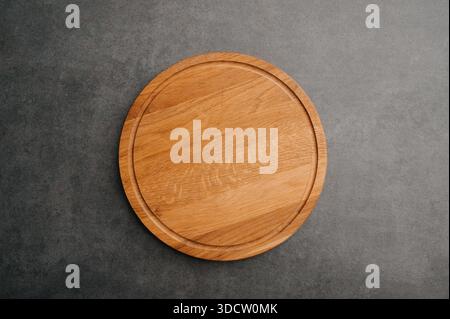 Meat or bread cutting board for homemade baking on table. Food recipe concept at stone background texture with copy space. Flat lay top view. Stock Photo