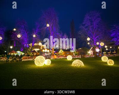 Freiburg im Breisgau, Germany, December 19, 2025, Famous Christmas market in the old town winter evening blue light Stock Photo