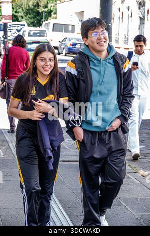 Puebla Mexico,Centro Historico historic center centre,Avenida Reforma,outside exterior,teen boy,teen girl,students walking,backpacks,eyeglasses,casual Stock Photo