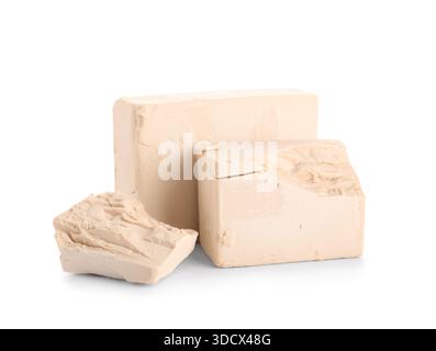 Blocks of fresh yeast on white background Stock Photo