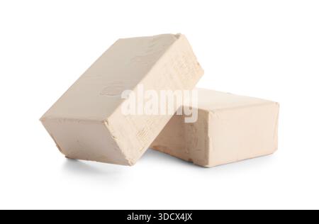 Blocks of fresh yeast on white background Stock Photo