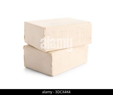 Blocks of fresh yeast on white background Stock Photo
