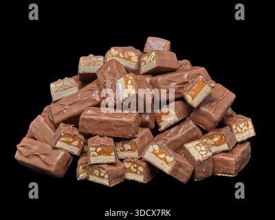 October 27, 2024, Palm Springs, California, USA: Snickers chocolate candy bars cut into pieces, showing layers of nougat, caramel, and peanuts coated in milk chocolate. Snickers was introduced in 1930 by Mars, Incorporated and has become one of the worldâ€™s best-selling chocolate bars, distributed globally. (Credit Image: © Ian L. Sitren/ZUMA Press Wire) EDITORIAL USAGE ONLY! Not for Commercial USAGE! Stock Photo