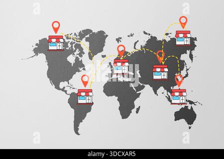 Global business network concept. The image features a world map with store icons placed in different continents, connected with lines, indicating a di Stock Photo