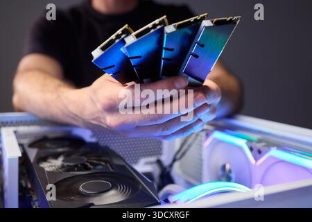 Computer hardware setup highlighting RAM sticks and graphics card details, Credentials for professional technical environment featuring RAM modules Stock Photo