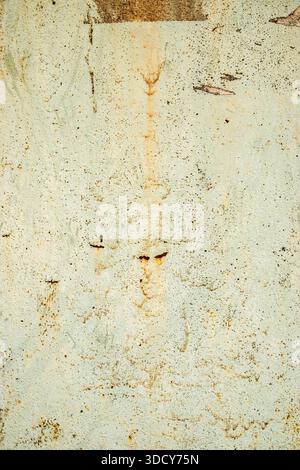 Weathered rusty metal surface with peeling paint, expressive grunge texture for industrial design backgrounds Stock Photo