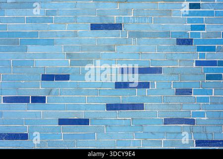 Background from a wall made of small blue stone tiles Stock Photo
