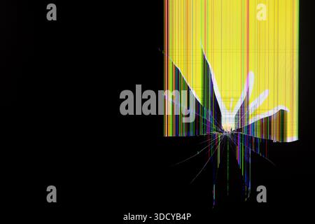 Abstract view of a malfunctioning digital monitor, exhibiting intricate radiating cracks, a bright yellow area with vertical multicolored pixel lines, Stock Photo