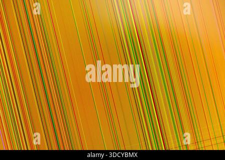 Detailed view of a vibrant abstract pattern with numerous thin diagonal lines in yellow, red, and green, clearly suggesting digital information, scree Stock Photo