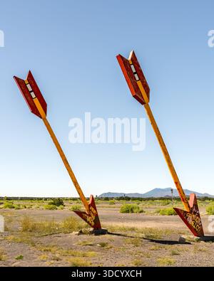 On ROUTE 66, Two landmark arrows, abandoned Twin Arrows Trading Post, Winslow, Arizona. Stock Photo