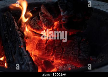 warm and cozy close up of red flames in a wood fire Stock Photo