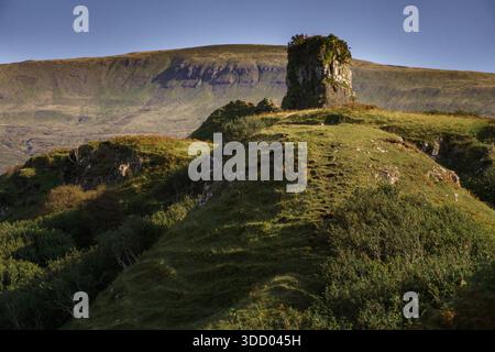Rocky hill and winding green landscape at the Fairy Glen on the Isle of Skye, showcasing dramatic Scottish Highlands scenery. Stock Photo