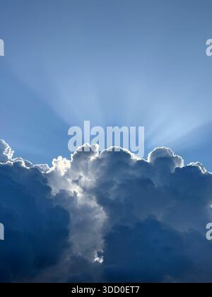 Dramatic sky storm cloud with sun rays Stock Photo