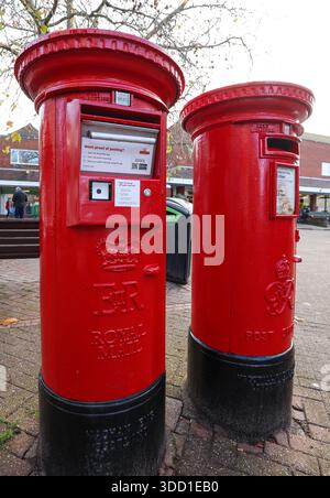 Royal Mail parcel post box next to a standard letter post box. Stock Photo