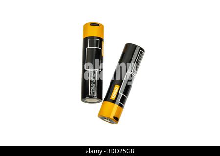 Two 18650 lithium-ion rechargeable batteries with built-in micro-USB charging ports and LED status indicators, isolated on a white background. Stock Photo