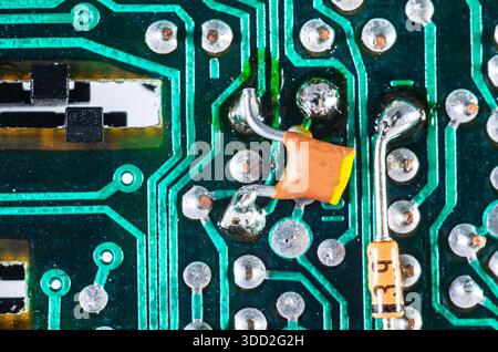 Close-up view of a vintage electronic circuit board with components and solder joints Stock Photo