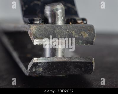 Extreme close-up macro shot of the worn blades of a metal staple remover Stock Photo