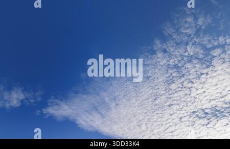 High altitude cirrocumulus clouds at blue sky, Finland Stock Photo