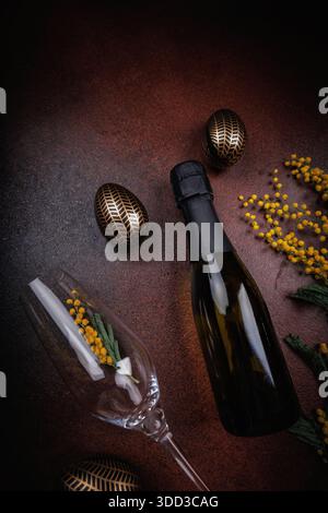 Elegant Easter still life with champagne and mimosa flowers Stock Photo