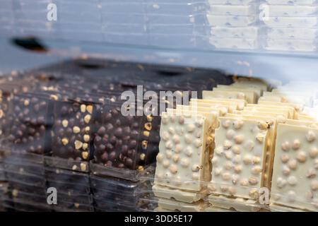Close-up of premium artisan dark and milk chocolate bars displayed in a boutique shop Stock Photo