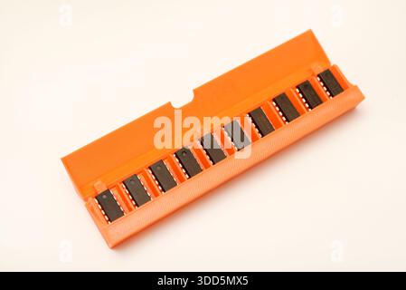 Microchips in a plastic case. Integrated circuits in a plastic storage case. Electronic chips. Stock Photo