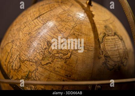 Antique globe showing the region of Japan on display at the Musée des Arts et Métiers, highlighting historic cartography craftsmanship, Paris, France Stock Photo
