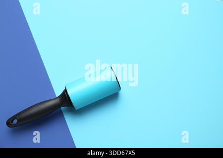Lint roller on color background Stock Photo