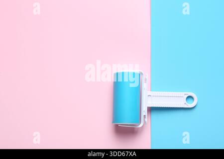 Lint roller on color background Stock Photo