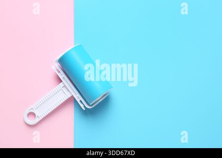 Lint roller on color background Stock Photo